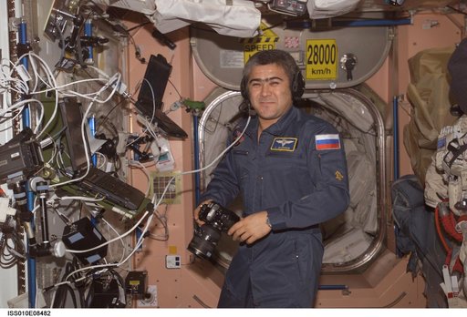 Sharipov holds a still camera in the Node 1 during Expedition 10
