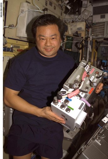 Chiao holds an Electronic Box Assembly from the TVIS in the SM during Expedition 10