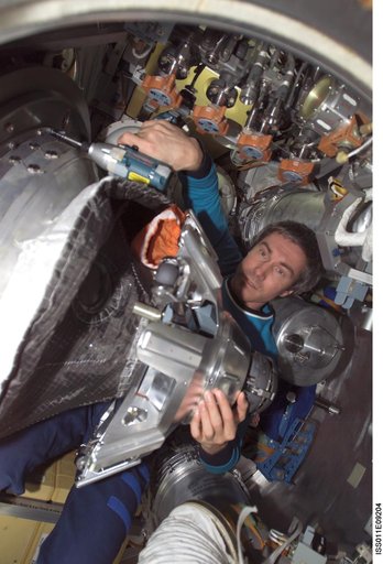 Krikalev dismantles probe-and-cone docking mechanism (StM) in the Progress M-53 (18P)