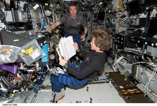 Lawrence and Krikalev in Destiny laboratory module during transfer operations.