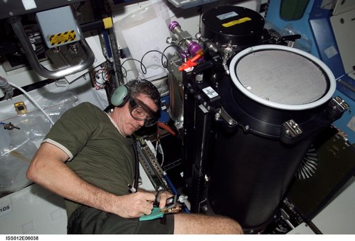 McArthur conducts troubleshooting operations on the TCCS during Expedition 12
