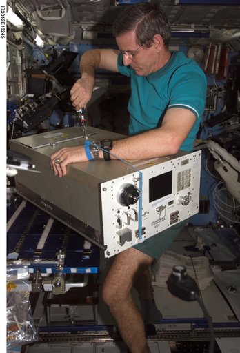 McArthur replaces the top panels on the VOA during In-flight Maintenance on Expedition 12