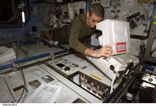 McArthur completes a battery charge on the defibrillator during Expedition 12