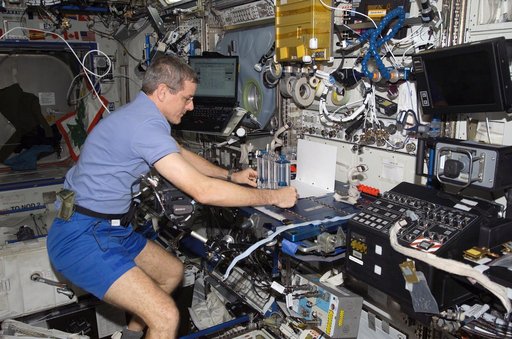 McArthur positions the CFE in preparation to video it during Expedition 12