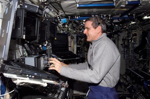 McArthur works at the RWS during video inspection of the IUA during Expedition 12