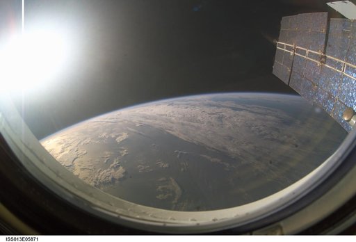 Setting sun on Earths horizon taken by Expedition 13 crew member