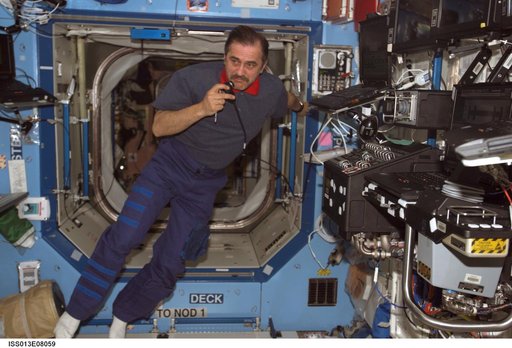Vinogradov uses communication equipment in the U.S. Laboratory during Expedition 13