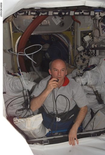 Williams uses communication equipment in the Airlock during Expedition 13