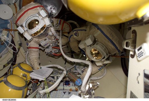Vinogradov wearing Russian Orlan Space Suit in the Pirs Docking Compartment (DC1) during Expedition 13