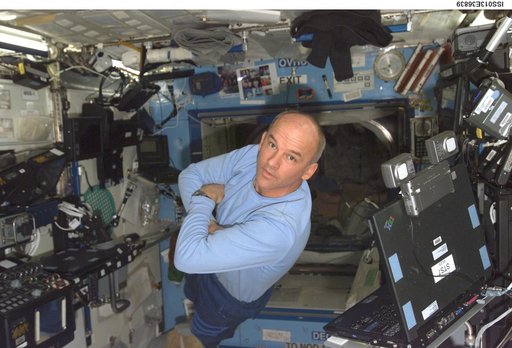Williams poses for photo in the U.S. Laboratory during Expedition 13