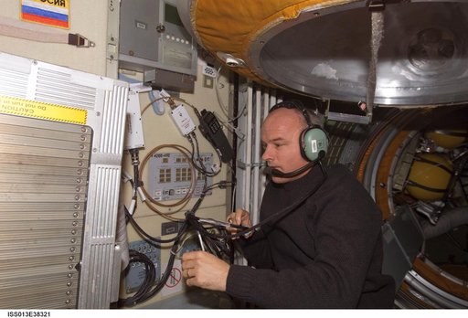 Williams uses an amateur radio in the FGB during Expedition 13