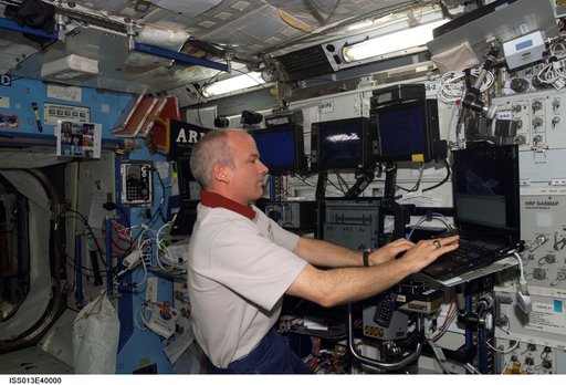 Williams uses laptop computer in the U.S. Laboratory taken during Expedition 13