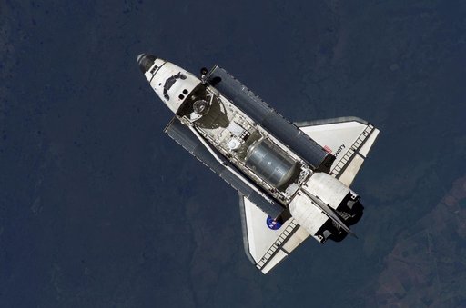 Discovery approaching the ISS for docking during the STS-121 mission