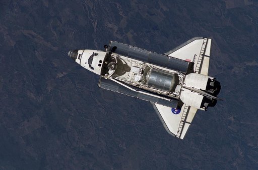 Discovery approaching the ISS for docking during the STS-121 mission