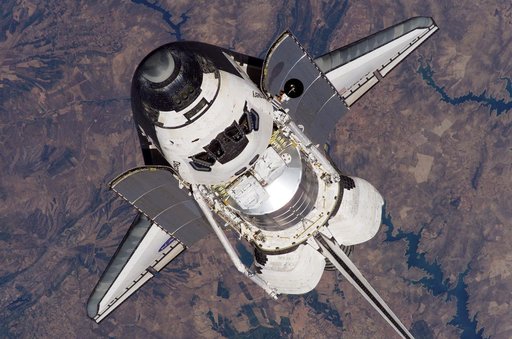 Discovery approaching the ISS for docking during the STS-121 mission