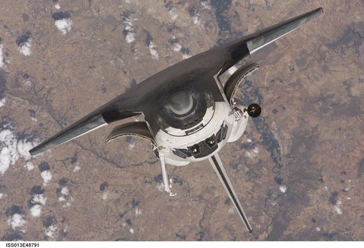 Discovery approaching the ISS for docking during the STS-121 mission