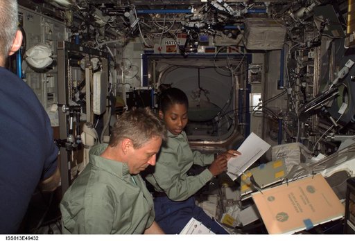 Reiter and Wilson look over procedures in the U.S. Laboratory during Expedition 13