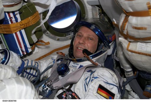 Reiter conducts a fit check of the Kazbek couches in the Soyuz TMA-8/12S