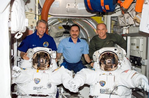 Crewmembers pose in the Quest A/L during Expedition 13