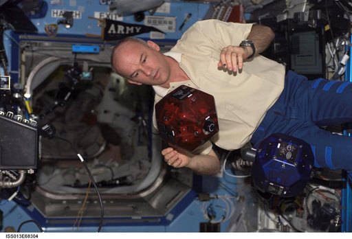 Williams checks SPHERES in the U.S. Laboratory during Expedition 13