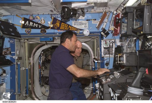 Lopez-Alegria and Williams working in the U.S. Laboratory