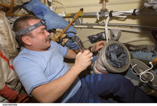 Inspection of Russian Orlan Space Suit in the Pirs module prior to Russian EVA