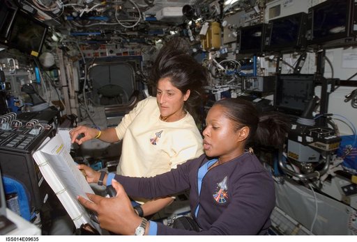 Higginbotham and Williams at SSRMS controls in Destiny laboratory
