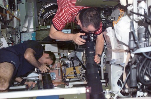 Lopez-Alegria and Tyurin in Zvezda with cameras