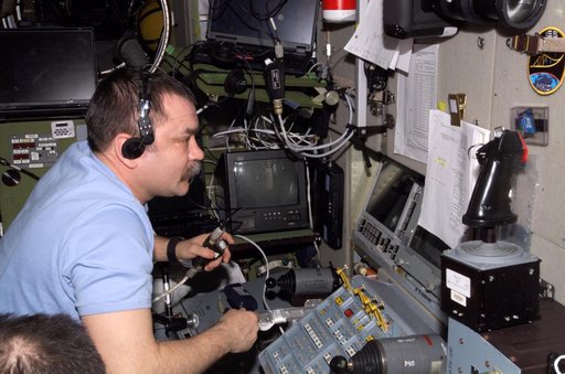 Tyurin works with the TORU teleoperated control system in the SM during Expedition 14