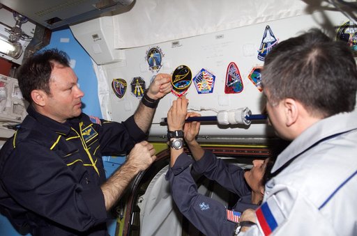 Expedition 14 crew adds patch to collection in Quest airlock module