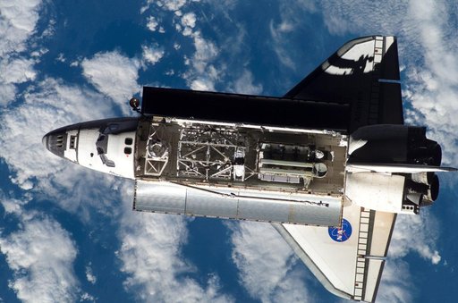 Atlantis and Payload on approach to the ISS during the STS-117 Mission