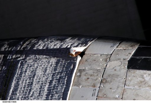 Survey view of damage to the STS-117 OMS Pod taken by an Expedition 15 Crewmember