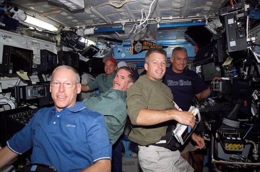 STS-117 Crew working in the US Lab during Expedition 15/STS-117 Joint Operations