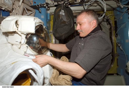 View of Yurchikhin working with an EMU in the A/L during Expedition 15