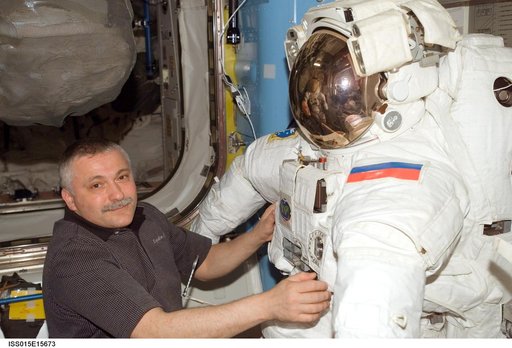 View of Yurchikhin working with an EMU in the A/L during Expedition 15