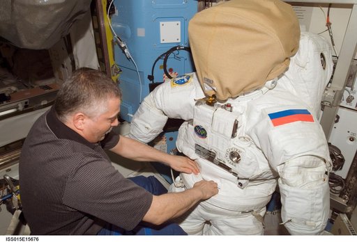 View of Yurchikhin working with an EMU in the A/L during Expedition 15