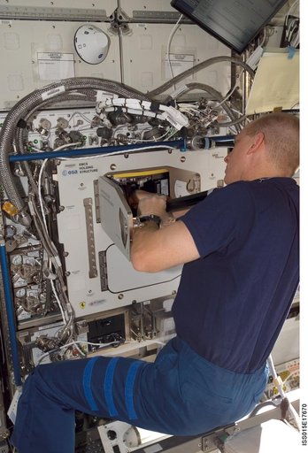 View of Anderson working on the EMCS in the US Lab during Expedition 15