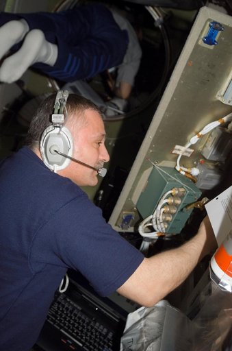View of Yurchikhin working on SMCC2 Command Processing Unit during Expedition 15