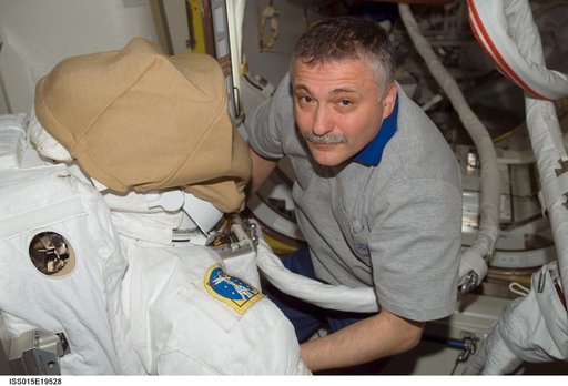 View of Yurchikhin posing with an EMU in the A/L during Expedition 15