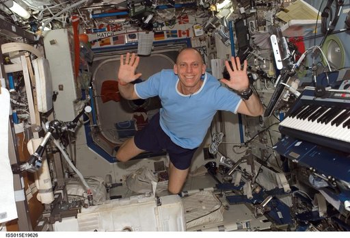 View of Anderson posing for a photo in the US Lab during Expedition 15
