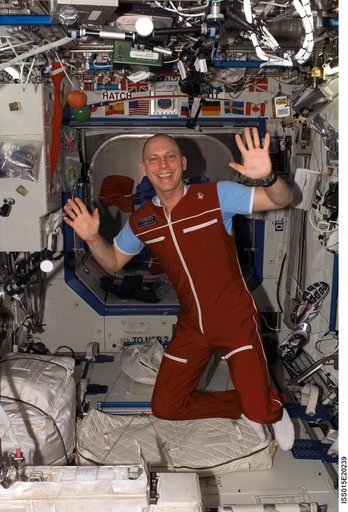 View of Anderson posing for a photo in the US Lab during Expedition 15