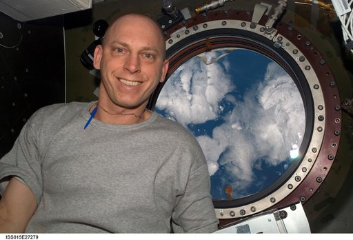 View of Anderson posing for a photo in the US Lab during Expedition 15