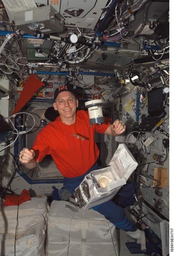 Anderson gathers air samples in the US Lab during Expedition 15