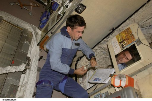 Expedition 16 FE Malenchenko working on the Conjugation Experiment Hardware in the SM