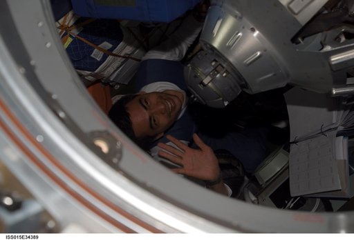 View of Spaceflight Participant Shukor exiting the docked Soyuz