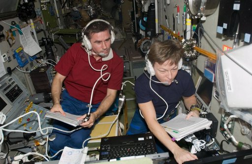 Malenchenko and Whitson during docking procedures for Progress 27P Spacecraft