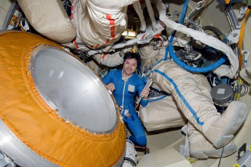 Kononenko holds a canister in the Pirs DC1 during Expedition 17