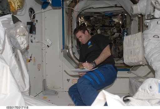 Chamitoff looks at crew procedures in the Node 1 during Expedition 17
