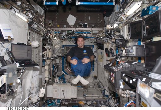 Chamitoff floats in the U.S. Laboratory during Joint Operations