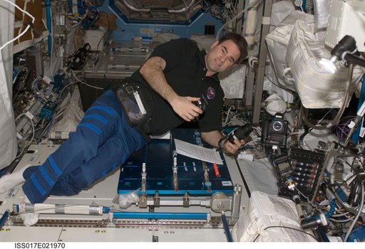Chamitoff works with camera equipment in the U.S. Laboratory during Expedition 18